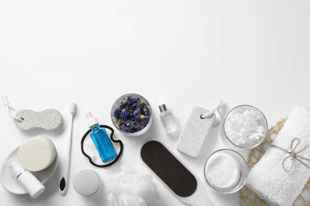 Bath accessories. Flat lay composition with personal care products on white background, space for...