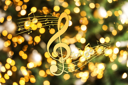 Music notes on blurred background, bokeh effect. Christmas and New Year melodyの写真素材