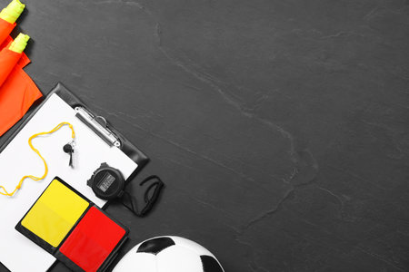 Different referee equipment on black table, flat lay. Space for textの写真素材