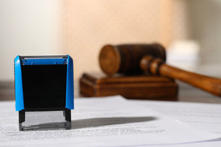 Notary contract. Stamp, documents and gavel on tableの写真素材