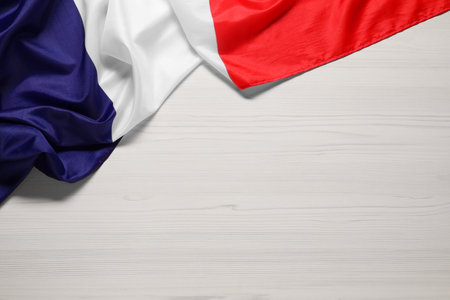 Flag of France on white wooden background, top view. Space for textの写真素材