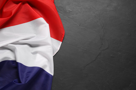 Flag of the Netherlands on black background, top view. Space for textの写真素材