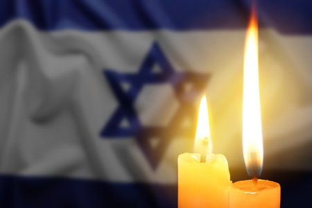 Burning candles against flag of Israel, closeupの写真素材