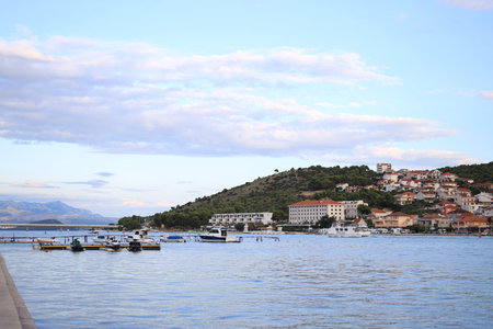 Picturesque view of town, mountains and seaの写真素材