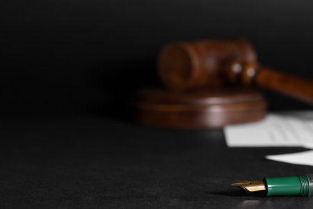 Fountain pen on dark table, closeup with space for text. Notary serviceの写真素材