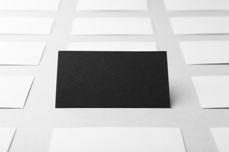 Blank black and white business cards on light background, closeup. Mockup for designの写真素材