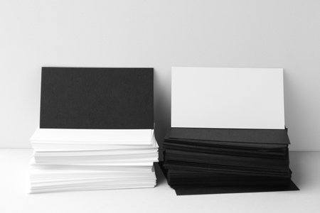 Blank business cards on white background. Mockup for designの写真素材