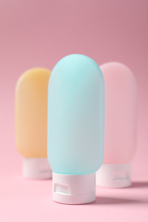 Cosmetic travel kit on pink background. Bath accessoriesの写真素材