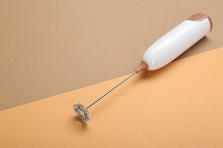 White milk frother wand on color background, space for textの写真素材