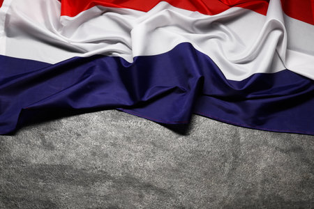 Flag of Netherlands on gray background, top view. Space for textの写真素材