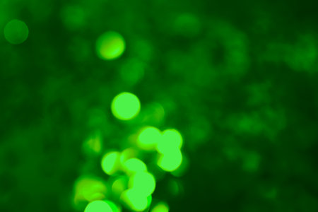 St. Patrick's day. Green background with blurred lights, bokeh effectの写真素材
