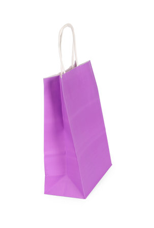 One lilac paper shopping bag isolated on whiteの写真素材
