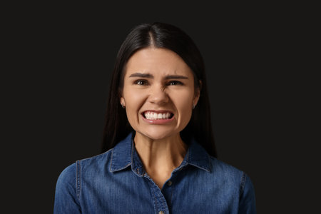 Personality concept. Emotional woman on black background