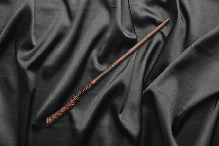 One magic wand on black fabric, top viewの写真素材