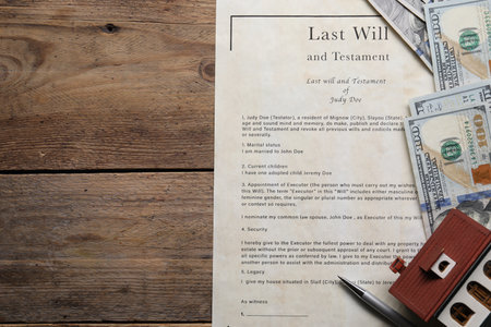 Last Will and Testament, dollar bills, house model and pen on wooden table, flat lay. Space for textの写真素材