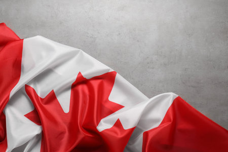 Flag of Canada on gray background, top view. Space for textの写真素材