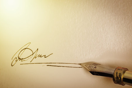 Signing on sheet of paper with fountain pen, top view. Space for textの写真素材