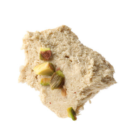 Piece of tasty pistachio halva isolated on whiteの写真素材