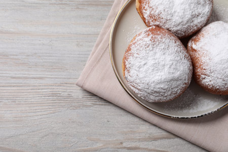 Delicious sweet buns on wooden table, top view. Space for textの写真素材