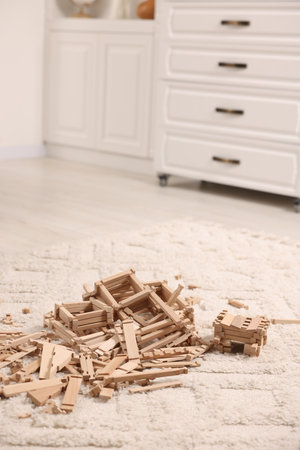 Wooden construction set on carpet indoors. Children's toysの写真素材