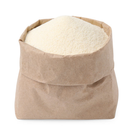 Paper bag with uncooked organic semolina isolated on whiteの写真素材