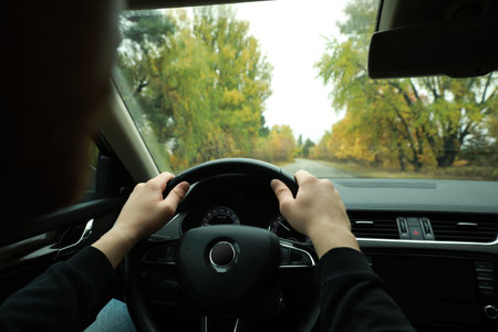 Man driving his car, closeup. Traffic rules