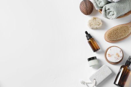 Bath accessories. Flat lay composition with personal care products on white background, space for textの写真素材