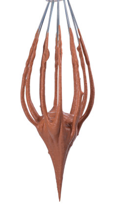 Chocolate cream flowing from whiskey on white background