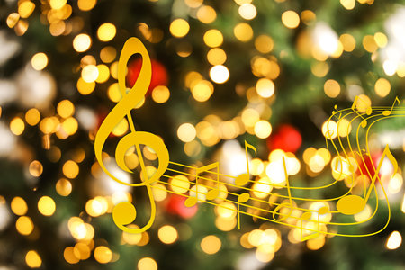 Music notes on blurred background, bokeh effect. Christmas and New Year melodyの写真素材
