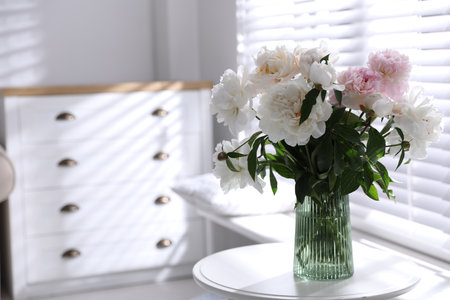 Bouquet of beautiful peony flowers on table indoors. Space for textの写真素材