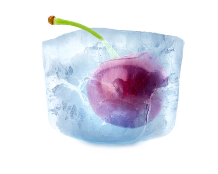 Frozen food. Raw cherry in ice cube isolated on whiteの写真素材