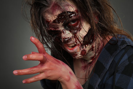 Scary zombie on dark background, closeup. Halloween monsterの写真素材