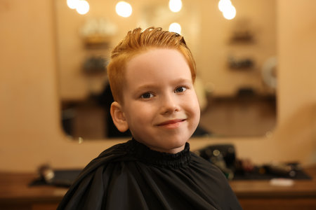 Little boy with hairstyle in beauty salonの写真素材