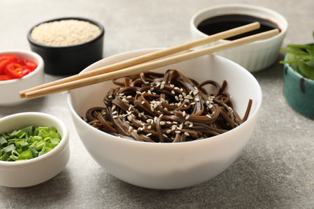 Tasty buckwheat noodles (soba) with sesame served on light gray tableの写真素材