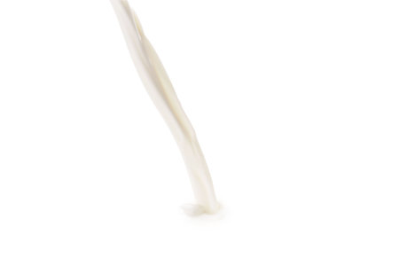 Pouring tasty fresh milk, closeup. Dairy productの写真素材