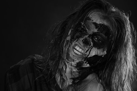 Scary zombie on dark background, black and white effect. Halloween monsterの写真素材