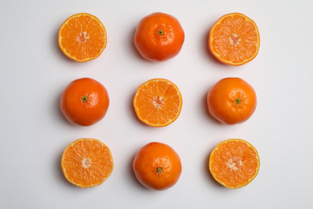 Delicious tangerines on white background, flat layの写真素材