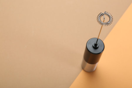 Milk frother wand on color background, above view. Space for textの写真素材