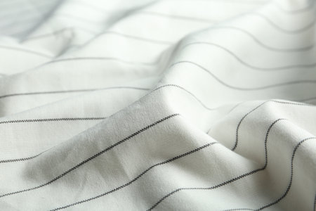 Texture of white striped fabric as background, closeup