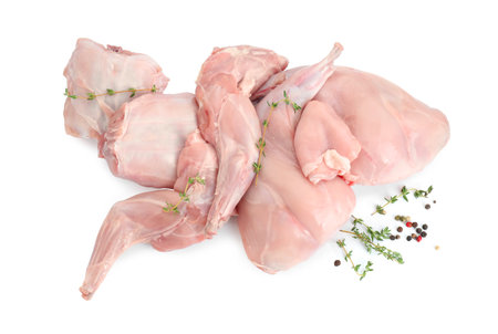 Fresh raw rabbit meat and spices isolated on white, top viewの写真素材