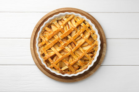 Tasty homemade quince pie on white wooden table, top viewの写真素材