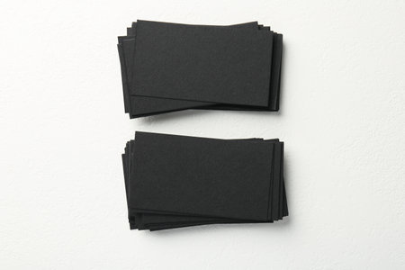 Blank black business cards on white table, top viewの写真素材