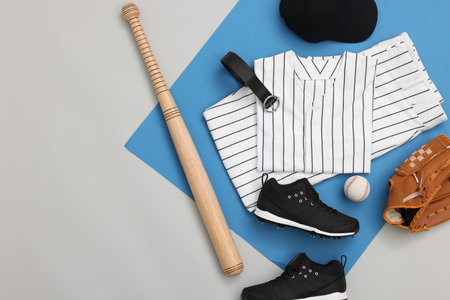 Flat lay composition with baseball uniform and sports equipment on color background. Space for textの写真素材