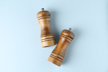 Wooden salt and pepper shakers on light background, top viewの写真素材