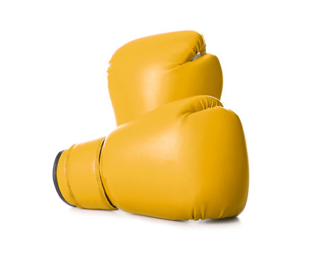 Pair of yellow boxing gloves isolated on whiteの写真素材