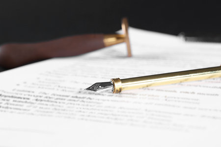 Fountain pen and paper document on table, closeup with space for text. Notary serviceの写真素材