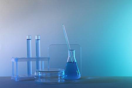 Laboratory analysis. Different glassware on table against color background, space for textの写真素材
