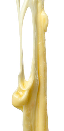 Stretching delicious melted cheese isolated on whiteの写真素材