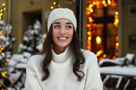 Portrait of smiling woman on city street in winter