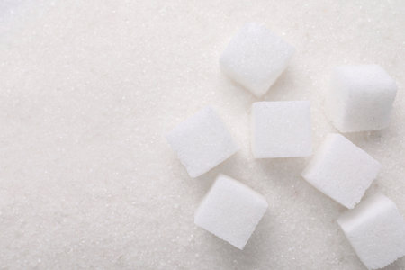 Different types of sugar as background, top view. Space for textの写真素材